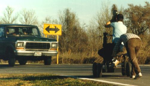 Roger rides his infernal contraption.