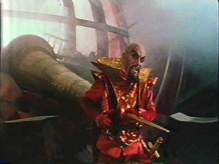 Ming the Merciless impaled on the spike of Flash Gordon's spaceship