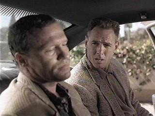 "I'm afraid I have to take you downtown. Not for firing your gun in public, mind you, but for missing Goldthwait altogether!"